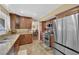 Traditional kitchen with stainless steel appliances, wood cabinets and granite counters at 6611 Ellerhurst Dr, Las Vegas, NV 89103