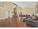 Inviting living room featuring hardwood floors, high ceilings, a chandelier, and a staircase at 6611 Ellerhurst Dr, Las Vegas, NV 89103