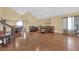 Spacious living room with hardwood floors, high ceilings, a chandelier, and comfortable leather furniture at 6611 Ellerhurst Dr, Las Vegas, NV 89103
