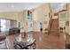 Open living room with hardwood floors, high ceilings, a staircase, and ample natural light at 6611 Ellerhurst Dr, Las Vegas, NV 89103