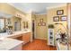 Bright bathroom with a large vanity, soaking tub, plants, and an open layout with ample lighting at 7172 Painted Paradise St, Las Vegas, NV 89131