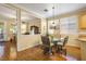 Bright breakfast nook with a glass table, hardwood floors, and natural light at 7172 Painted Paradise St, Las Vegas, NV 89131