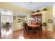 Formal dining room with hardwood floors and access to kitchen and breakfast nook at 7172 Painted Paradise St, Las Vegas, NV 89131