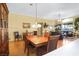 Open concept living and dining area boasting natural light, hardwood floors, and a ceiling fan at 7172 Painted Paradise St, Las Vegas, NV 89131