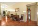 Charming entryway area with hardwood floors, decorative furniture and decor, and a vaulted ceiling at 7172 Painted Paradise St, Las Vegas, NV 89131