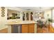 Open kitchen featuring a center island, stainless steel appliances, and views into dining areas at 7172 Painted Paradise St, Las Vegas, NV 89131