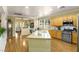 Updated kitchen with an island, granite countertops, and a full stainless-steel appliance package at 7172 Painted Paradise St, Las Vegas, NV 89131