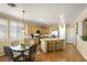 Spacious kitchen with a breakfast bar, stainless steel appliances, and hardwood floors at 7172 Painted Paradise St, Las Vegas, NV 89131
