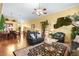 Spacious living room featuring hardwood floors, modern decor, and comfortable seating at 7172 Painted Paradise St, Las Vegas, NV 89131