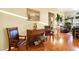 Sun-filled living room with hardwood floors, elegant furniture, and tasteful decor at 7172 Painted Paradise St, Las Vegas, NV 89131