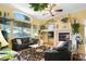 Inviting living room with fireplace, mantle, and neutral-colored walls at 7172 Painted Paradise St, Las Vegas, NV 89131