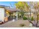 Spacious covered patio with grill, plants, and comfortable outdoor seating at 7172 Painted Paradise St, Las Vegas, NV 89131