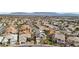 Aerial view of a residential neighborhood featuring well-maintained homes with terracotta roofs and palm trees at 7904 Riviera Beach Dr, Las Vegas, NV 89128