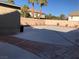 The spacious backyard is perfect for entertaining and includes block wall and palm trees at 8122 Delphi Ct, Las Vegas, NV 89117