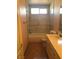 Bathroom featuring a vanity with marble countertops, shower and tub combination at 8122 Delphi Ct, Las Vegas, NV 89117