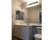 Bathroom featuring a vanity with marble countertops and large mirror at 8122 Delphi Ct, Las Vegas, NV 89117