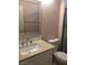 Bathroom featuring a white vanity, sink, and mirror at 8122 Delphi Ct, Las Vegas, NV 89117