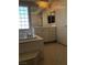 Bright bathroom featuring a soaking tub, marble countertops, and tiled floor at 8122 Delphi Ct, Las Vegas, NV 89117