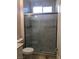 Bathroom with tiled shower and glass doors at 8122 Delphi Ct, Las Vegas, NV 89117