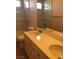 Bathroom with marble style walls, double vanity sink, large mirror, shower, and bath at 8122 Delphi Ct, Las Vegas, NV 89117