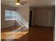 Bedroom featuring hardwood floors, a ceiling fan, and a closet at 8122 Delphi Ct, Las Vegas, NV 89117