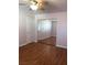 Bedroom with hardwood flooring and a mirror door closet in view at 8122 Delphi Ct, Las Vegas, NV 89117