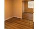 Bedroom featuring a mirrored closet and wood floors at 8122 Delphi Ct, Las Vegas, NV 89117