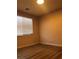 Bedroom featuring a large window and wood floors at 8122 Delphi Ct, Las Vegas, NV 89117