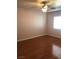 Bright bedroom with light hardwood flooring, and a large window with modern fixtures at 8122 Delphi Ct, Las Vegas, NV 89117