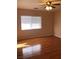 Bedroom with ceiling fan and light wood floors at 8122 Delphi Ct, Las Vegas, NV 89117