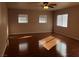 Spacious bedroom with hardwood floors and natural light from three windows at 8122 Delphi Ct, Las Vegas, NV 89117