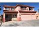 Charming two-story home with a three-car garage and balcony detail, showcasing a delightful exterior at 8122 Delphi Ct, Las Vegas, NV 89117