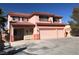 Charming two-story home with a three-car garage and balcony detail, showcasing a delightful exterior at 8122 Delphi Ct, Las Vegas, NV 89117