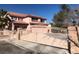 Wrought iron security gate with lush landscaping provide enhanced privacy and curb appeal at 8122 Delphi Ct, Las Vegas, NV 89117