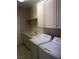 Laundry room with cabinetry, countertop, and washer and dryer at 8122 Delphi Ct, Las Vegas, NV 89117