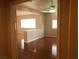 Open living space with hardwood floors, half wall, and neutral paint at 8122 Delphi Ct, Las Vegas, NV 89117