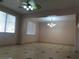 This living room features tile flooring and lots of natural light at 8122 Delphi Ct, Las Vegas, NV 89117