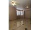 This living room features tile flooring and lots of natural light at 8122 Delphi Ct, Las Vegas, NV 89117