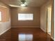 Living room with hardwood floors, a window, and an open floor plan at 8122 Delphi Ct, Las Vegas, NV 89117