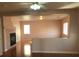 Living room with fireplace, half-wall, hardwood floors and natural light at 8122 Delphi Ct, Las Vegas, NV 89117