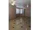 This living room features tile flooring and lots of natural light at 8122 Delphi Ct, Las Vegas, NV 89117