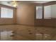 This living room features tile flooring and lots of natural light at 8122 Delphi Ct, Las Vegas, NV 89117