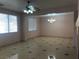 This living room features tile flooring and lots of natural light at 8122 Delphi Ct, Las Vegas, NV 89117
