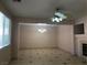 Open living room featuring tile floors, modern ceiling fan, and chandelier at 8122 Delphi Ct, Las Vegas, NV 89117