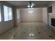 Open living room features tile floors, chandelier, and fireplace at 8122 Delphi Ct, Las Vegas, NV 89117