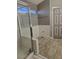 Bathroom features a tiled shower stall, bright lighting, with neutral tile flooring and easy access at 824 Holly Lake Way, Henderson, NV 89002