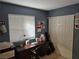 Bedroom with a desk and window view, features a double sliding door closet to maximize storage at 824 Holly Lake Way, Henderson, NV 89002