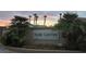 Palm Canyon community entrance sign surrounded by lush landscaping and palm trees at 824 Holly Lake Way, Henderson, NV 89002