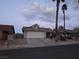 Inviting single-Gathering home featuring a spacious driveway and desert landscaping for low maintenance at 824 Holly Lake Way, Henderson, NV 89002