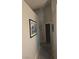 Neutral hallway features tiled floors, decorative rug, and artwork on the wall at 824 Holly Lake Way, Henderson, NV 89002